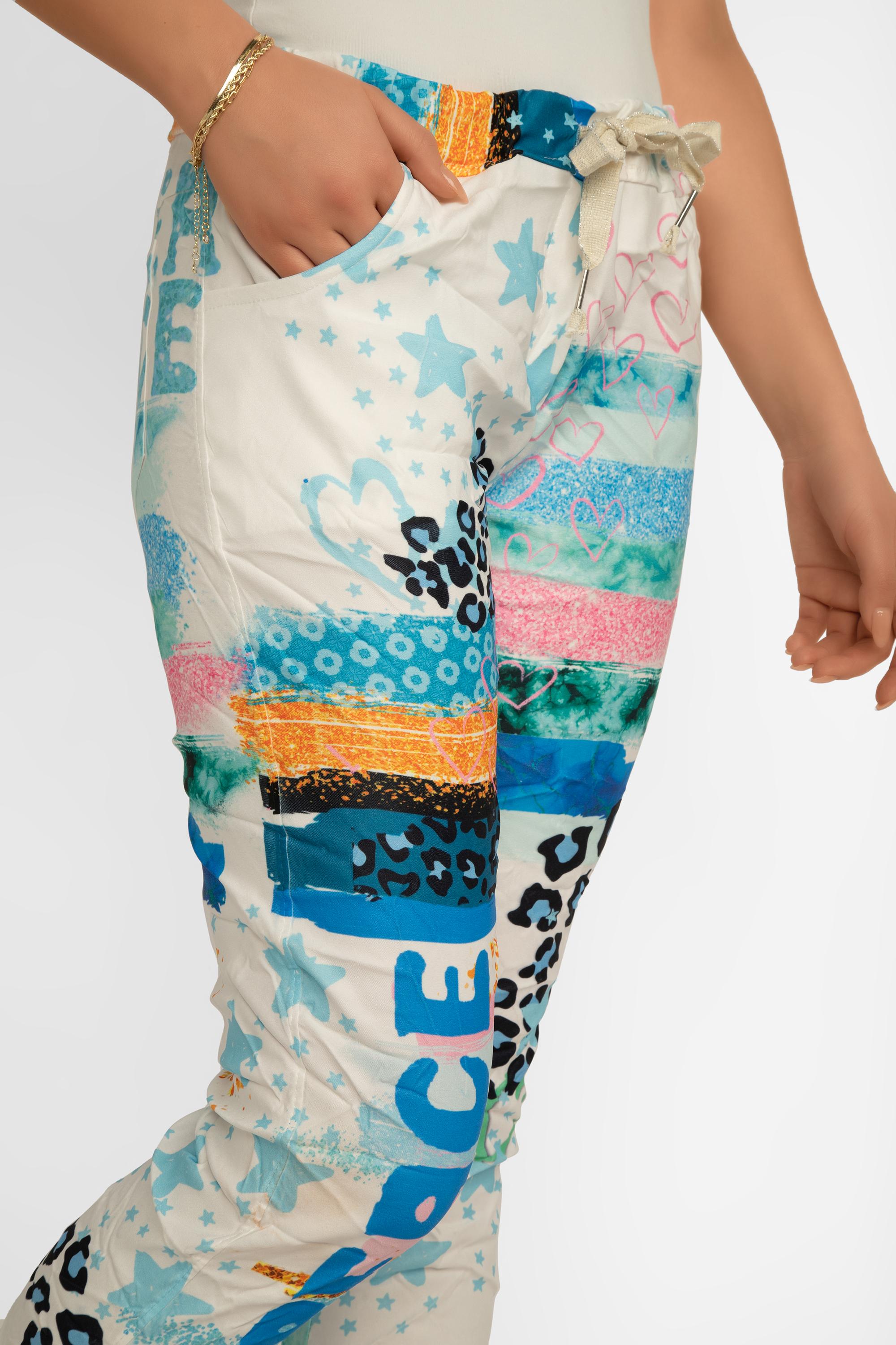 Side front view of Bella Amore Women's Cropped Multi Print Pull-On Pants in a Blue and multi-coloured patchwork print