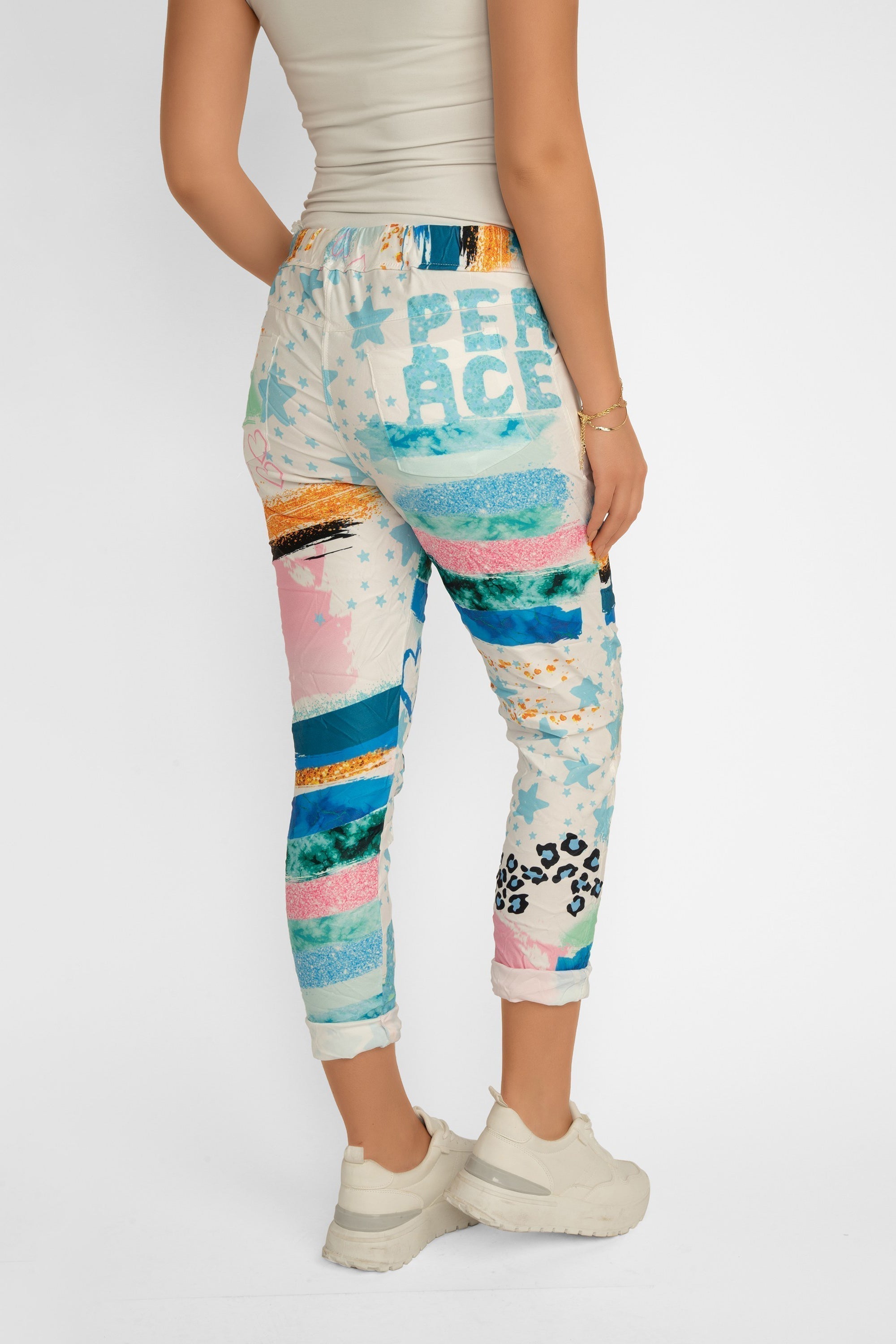Back view of Bella Amore Women's Cropped Multi Print Pull-On Pants in a Blue and multi-coloured patchwork print