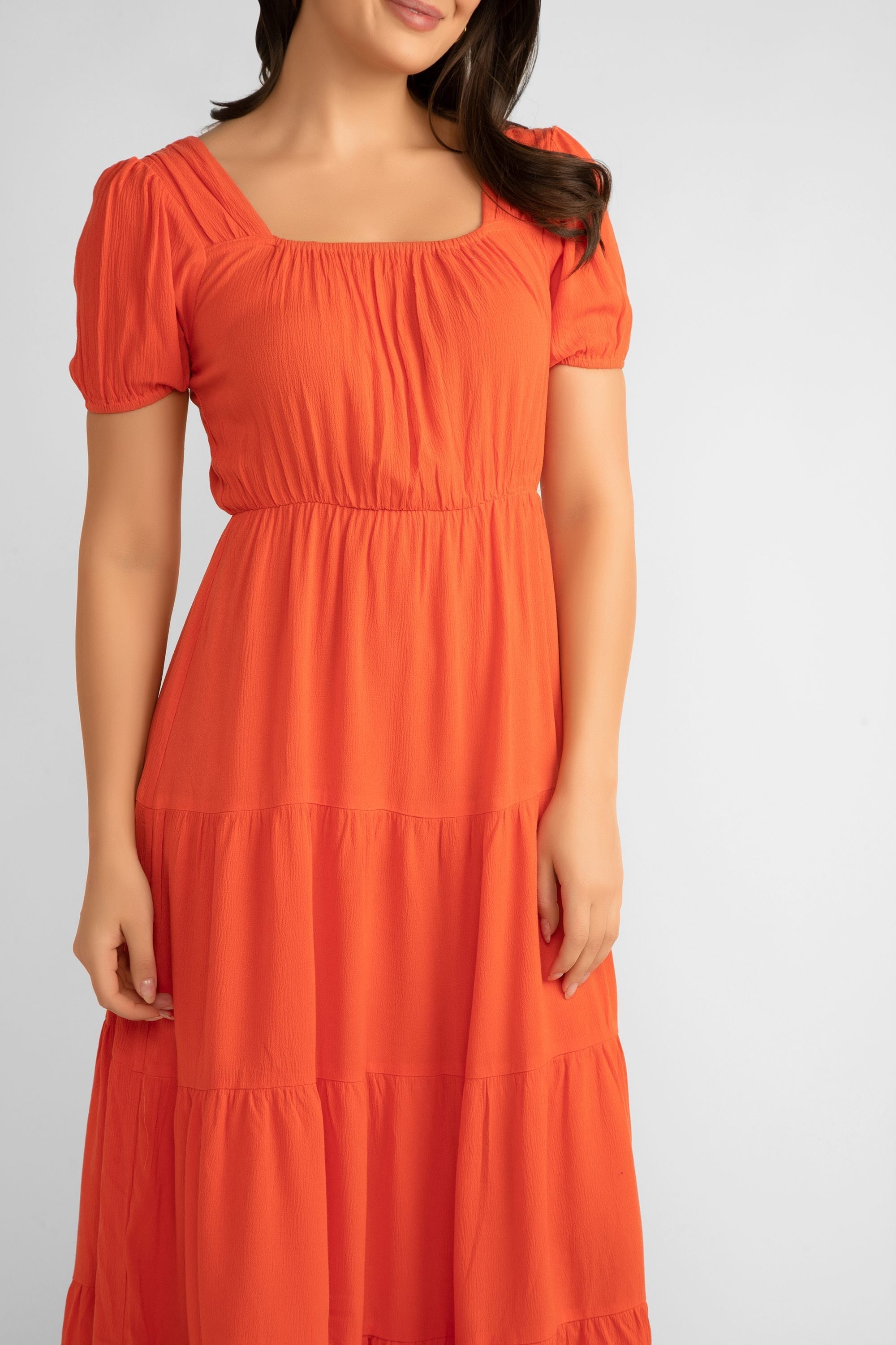 Front close up of Pink Martini (DR-230524) Women's Square Neck, Short Puff Sleeve Tiered Midi Dress in Orange