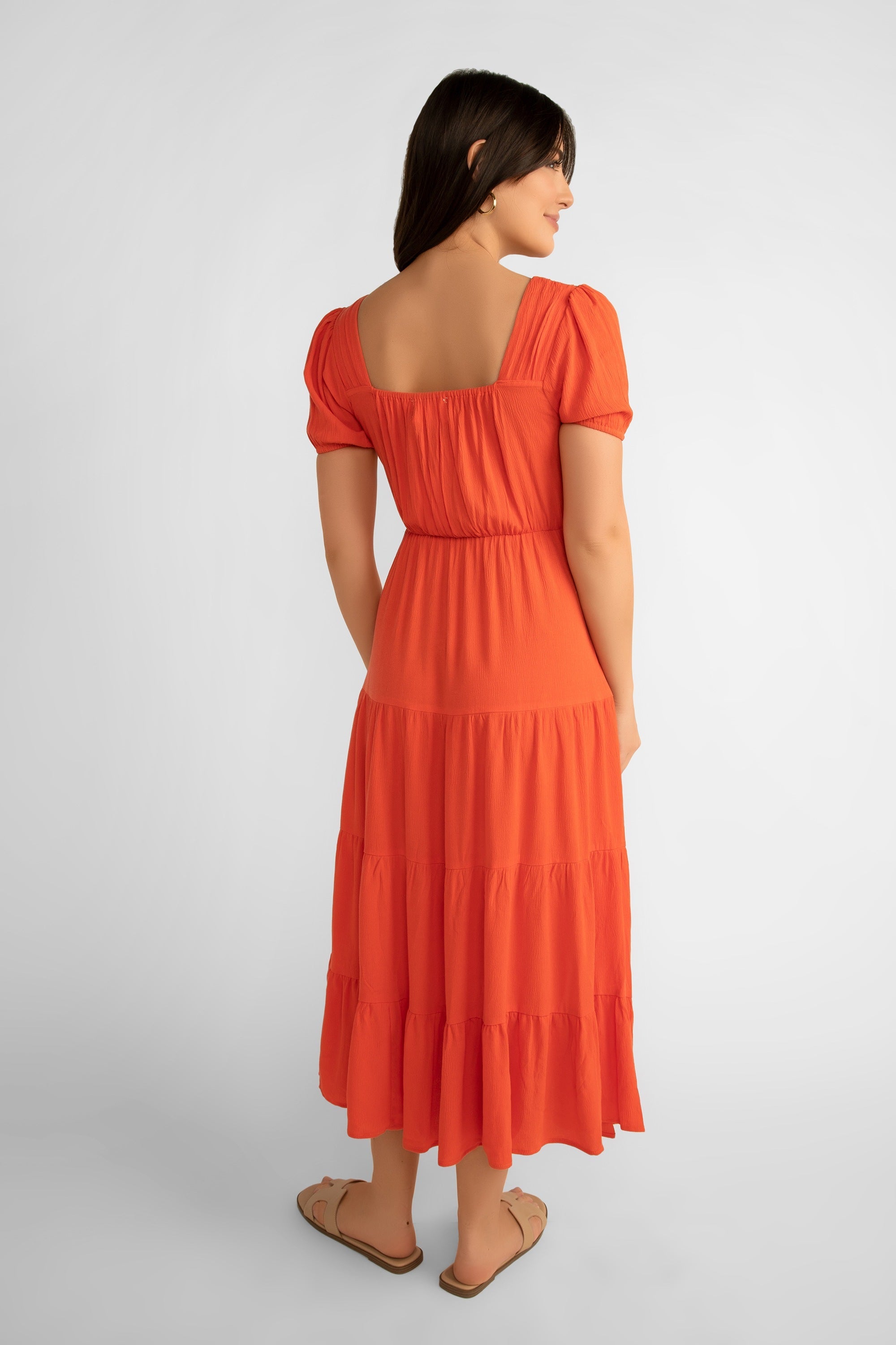 Back view of Pink Martini (DR-230524) Women's Square Neck, Short Puff Sleeve Tiered Midi Dress in Orange