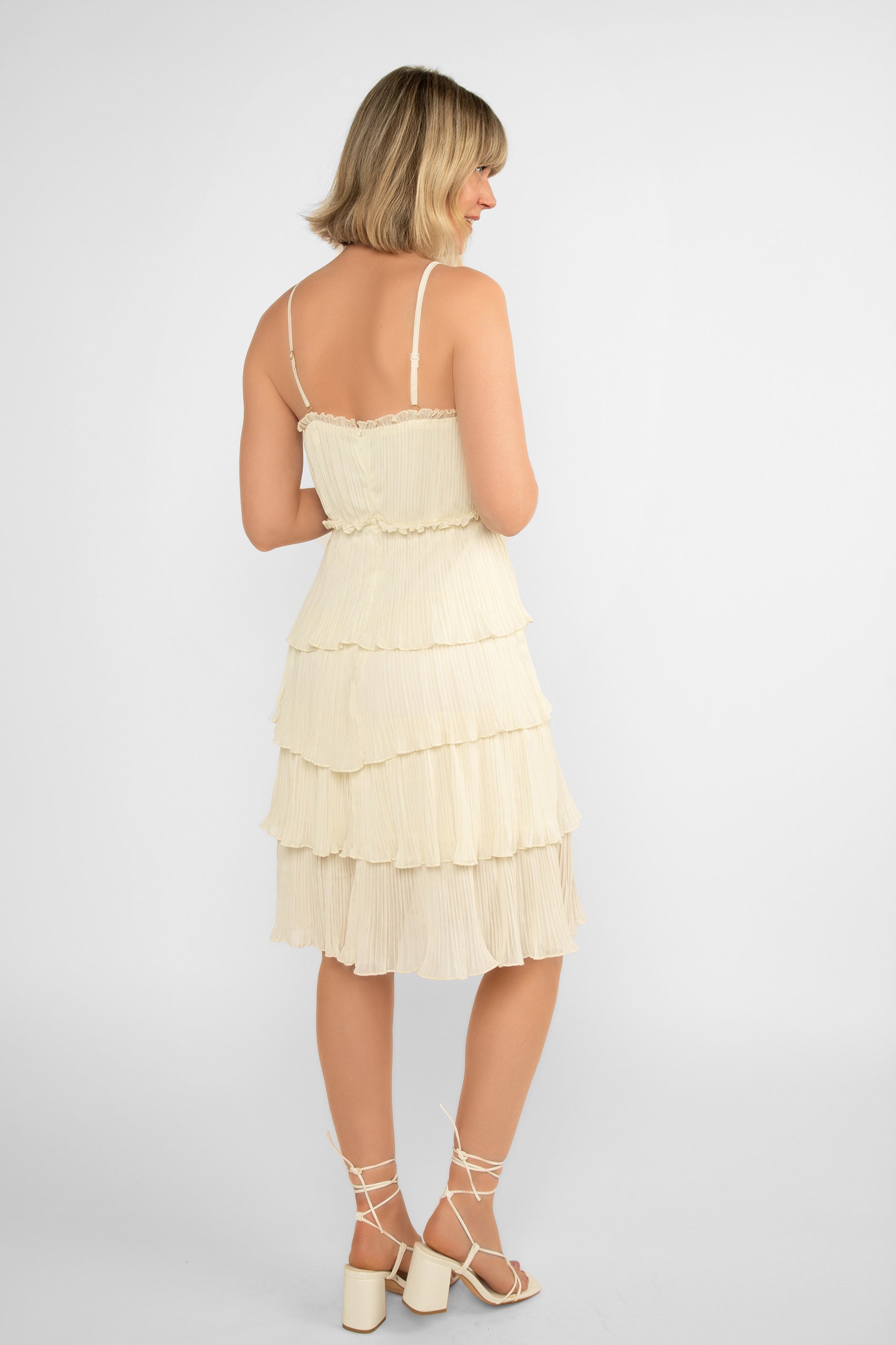 Back view of LATE (DR-6918391) Nikita Dress - Women's Sleeveless with Spaghetti Strap Knee Length Dress - lined pleated chiffon, layered knee length skirt in Off White