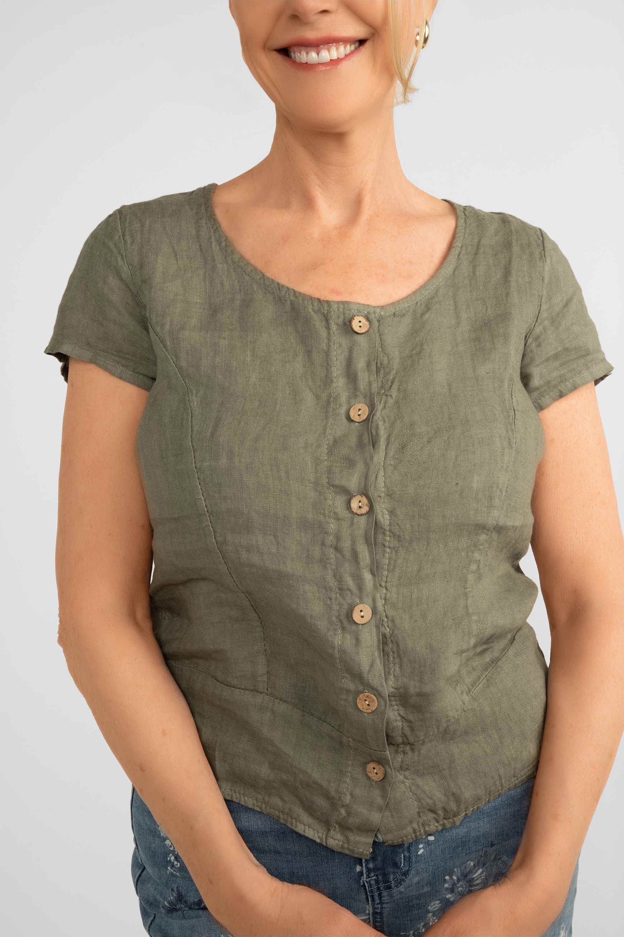 Close up front view of Me & Gee (F-A1804M-S2) Women's Short Sleeve Round Neck Button Up Linen Top in Military green