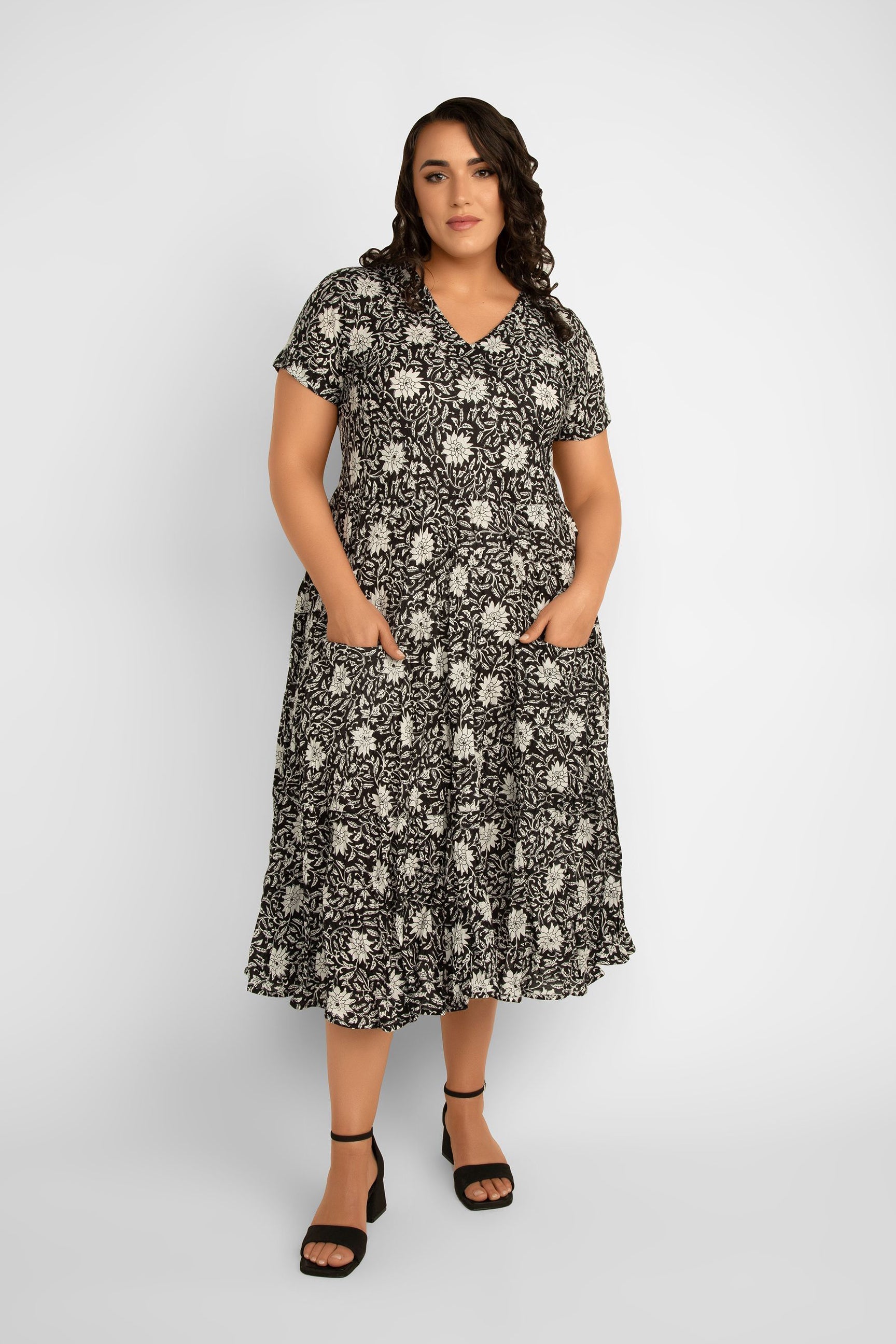 Dress Addict Jazi Short Sleeve V-Neck Tiered Midi Dress with Pockets in Black & White floral print