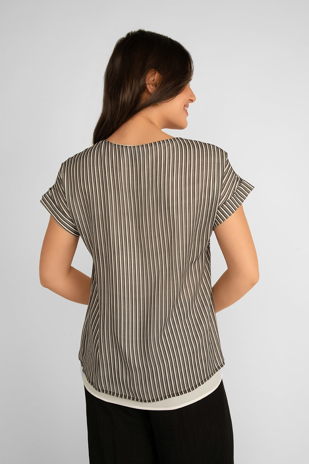 Back view of Picadilly (JS105FN) Women's Short Dolman Sleeve Striped Georgette Layered Blouse in a Black & White Patchwork Striped Print and white under layer