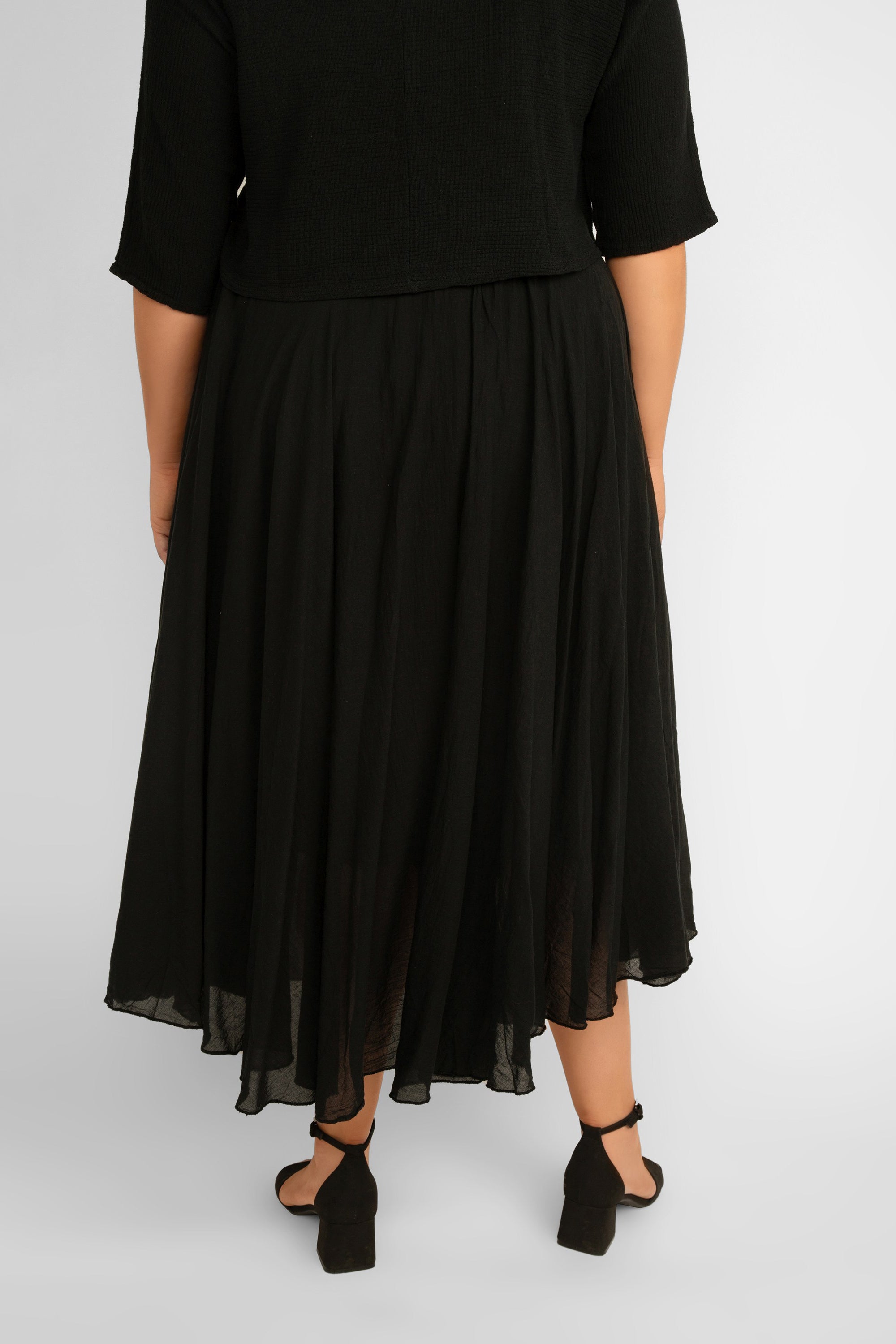Back view of Me & Gee (L-6759) Flowy Cotton Maxi Skirt in Black