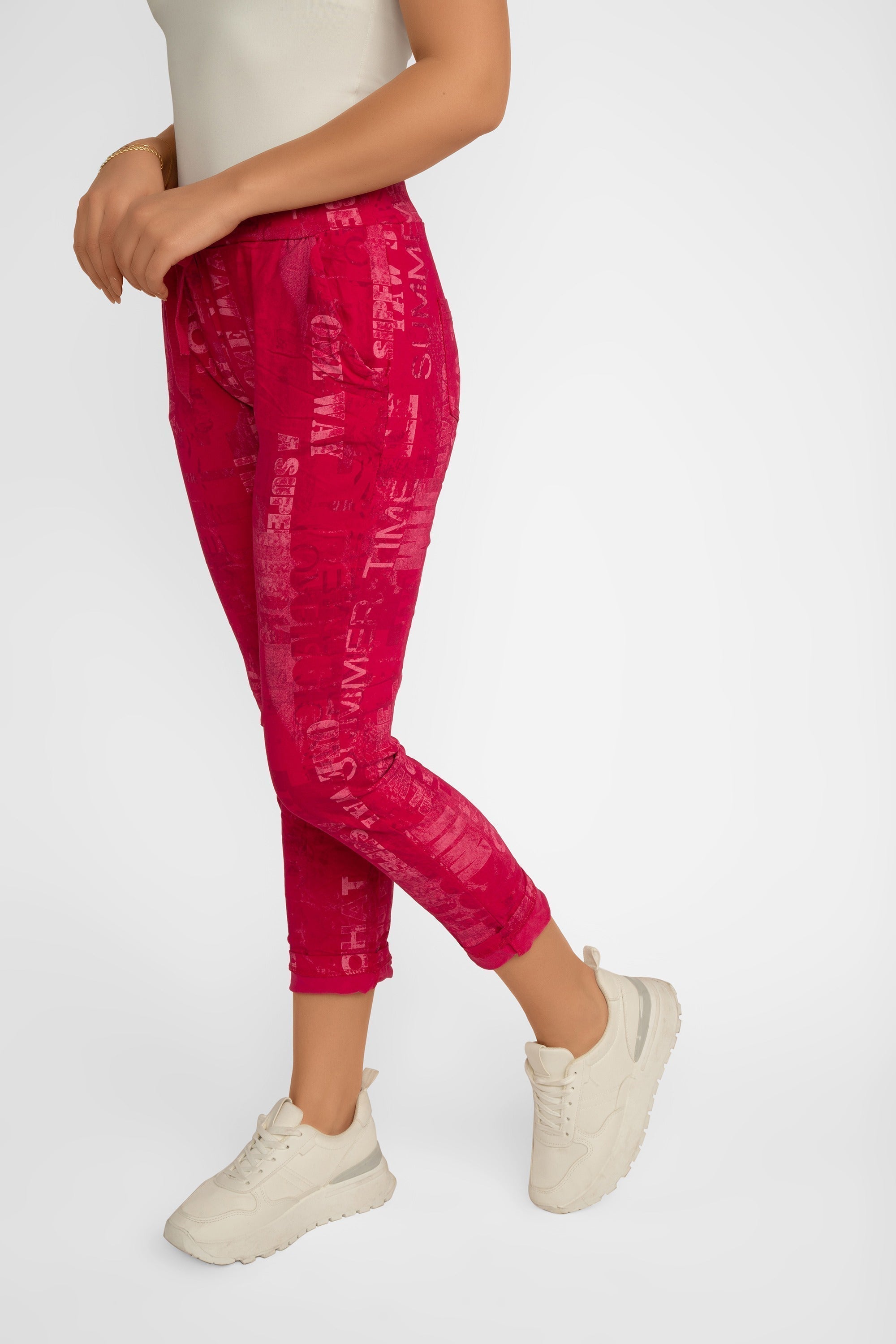 Side view of Elissia (L21026) Women's Pink Font Print Slim Fit, Cropped Crinkle Pants in Fuchsia