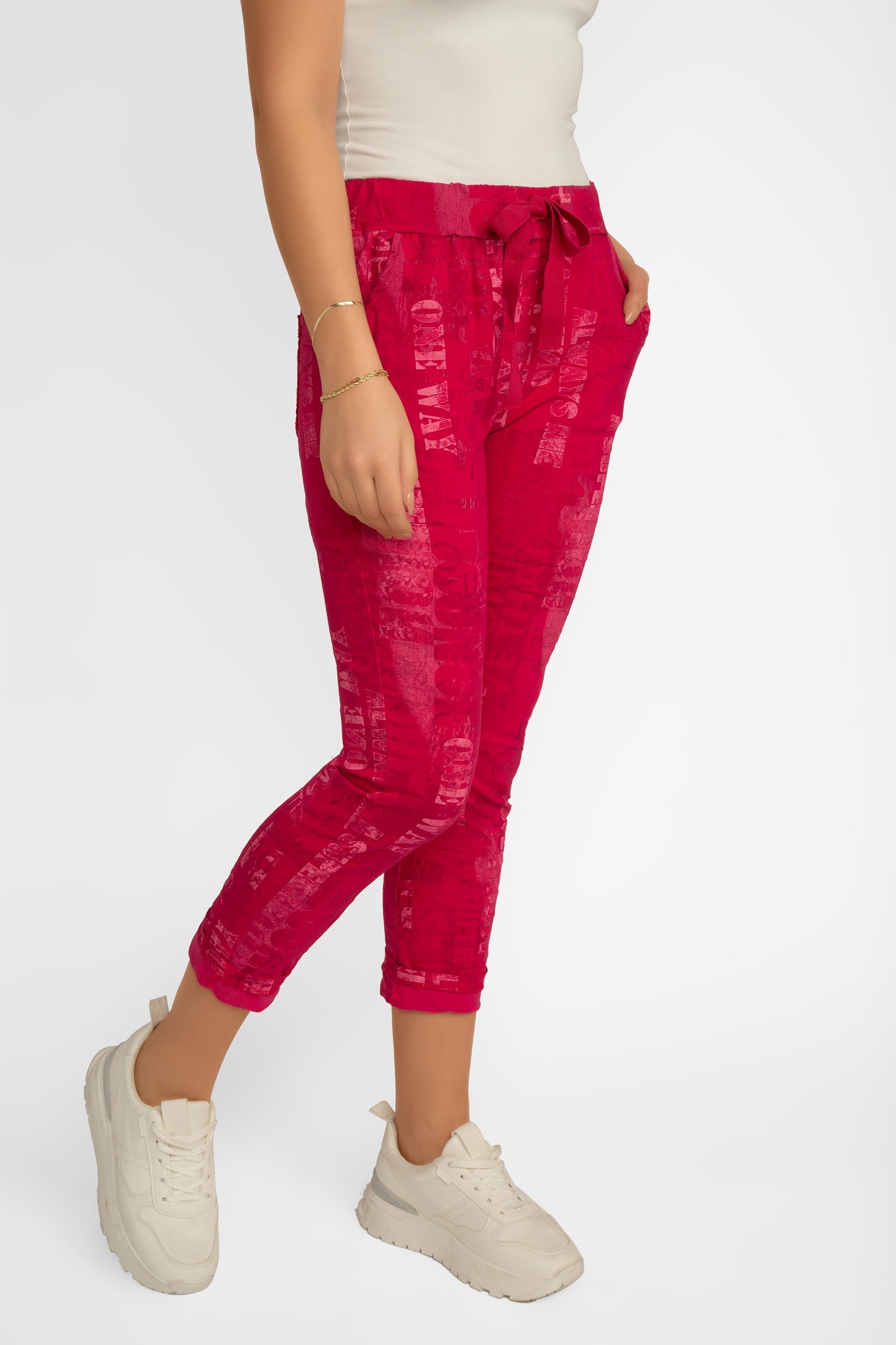 Front view of Elissia (L21026) Women's Pink Font Print Slim Fit, Cropped Crinkle Pants in Fuchsia