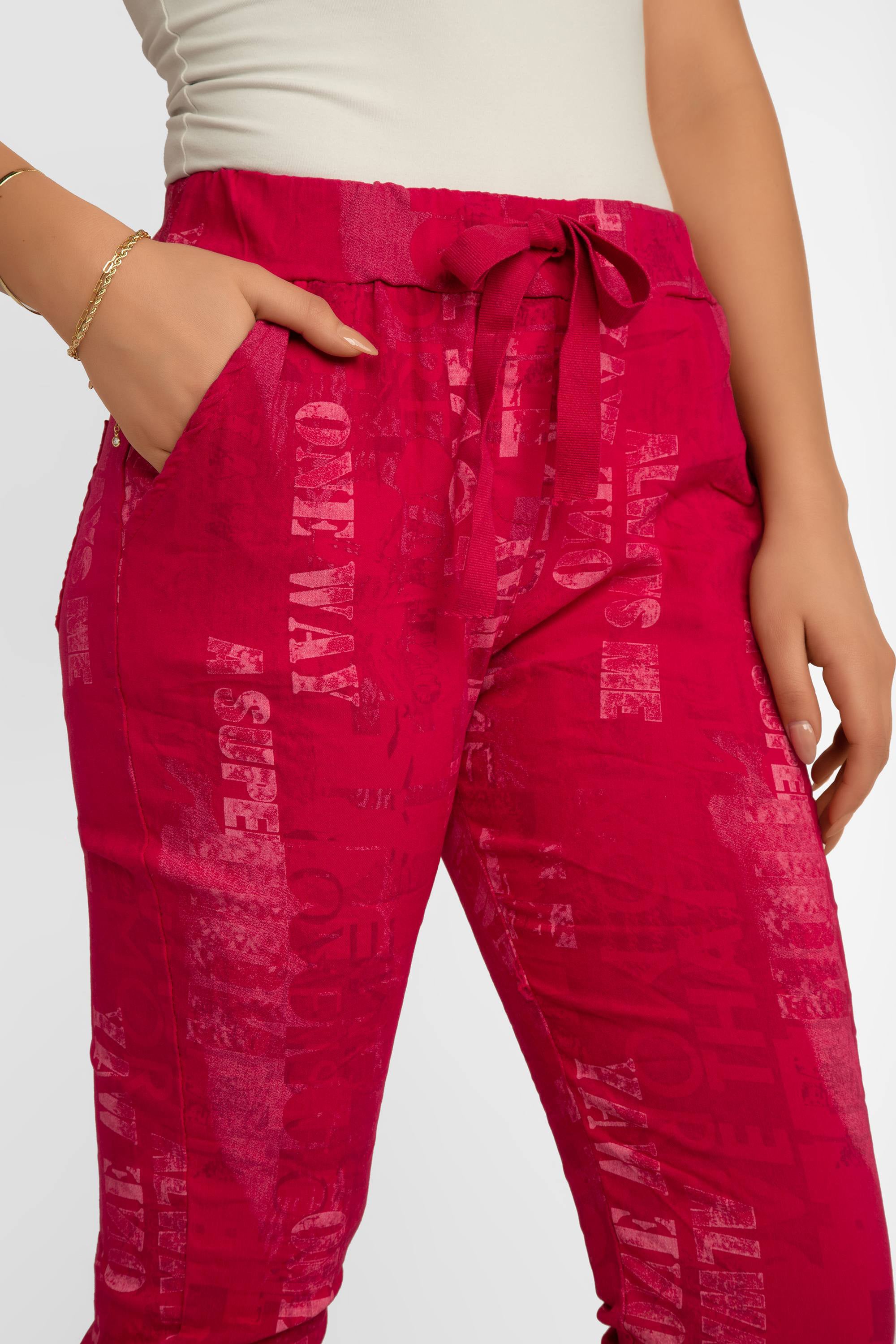 Front view of Elissia (L21026) Women's Pink Font Print Slim Fit, Cropped Crinkle Pants in Fuchsia