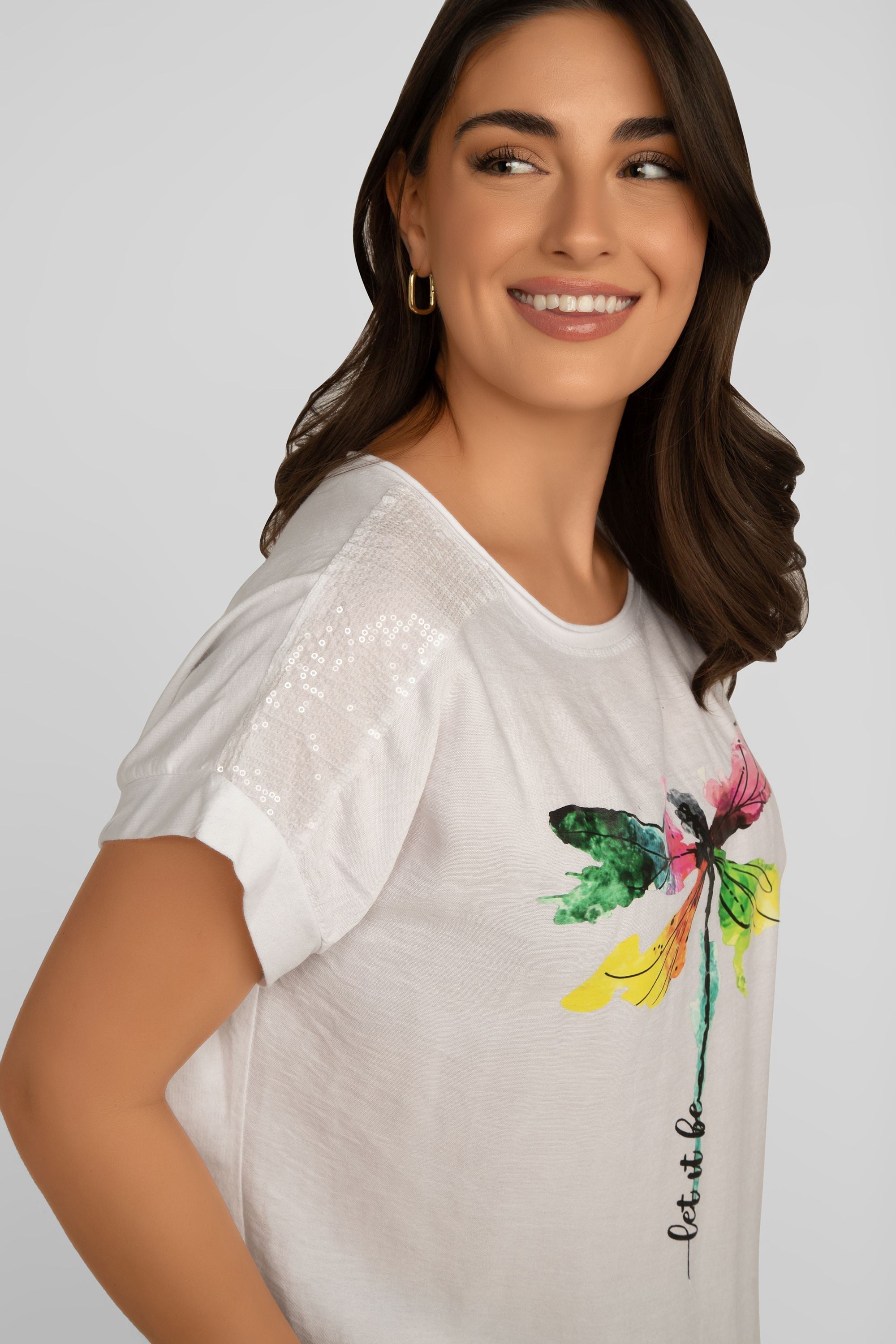 Side view of Elissia (LX34137A) Women's Dragonfly T-Shirt with Sequin Shoulders and Drawstring Hem in White
