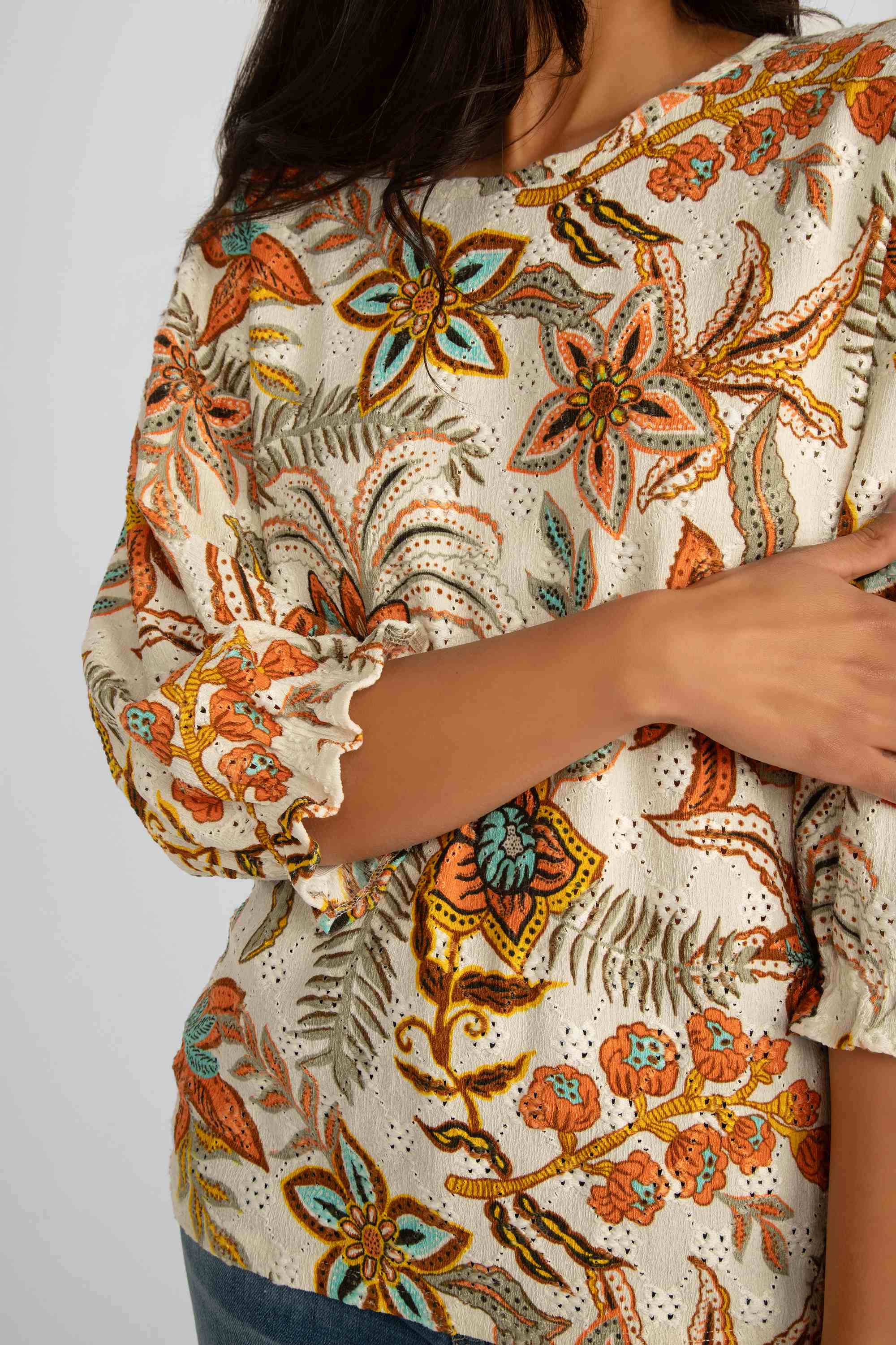 Close up front view of Garcia (Q40007) Women's Elbow Puff Sleeve Top with Back Cutoff in Retro Orange Floral Print