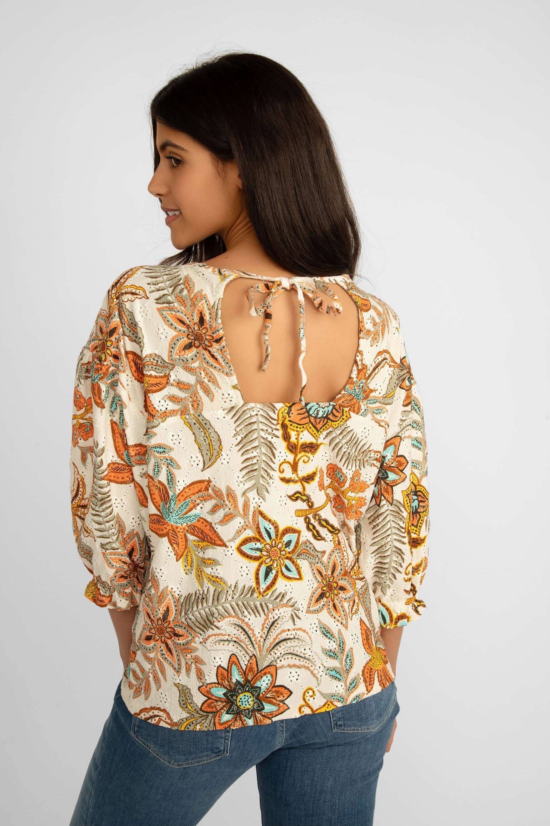 Back view of Garcia (Q40007) Women's Elbow Puff Sleeve Top with Back Cutoff in Retro Orange Floral Print