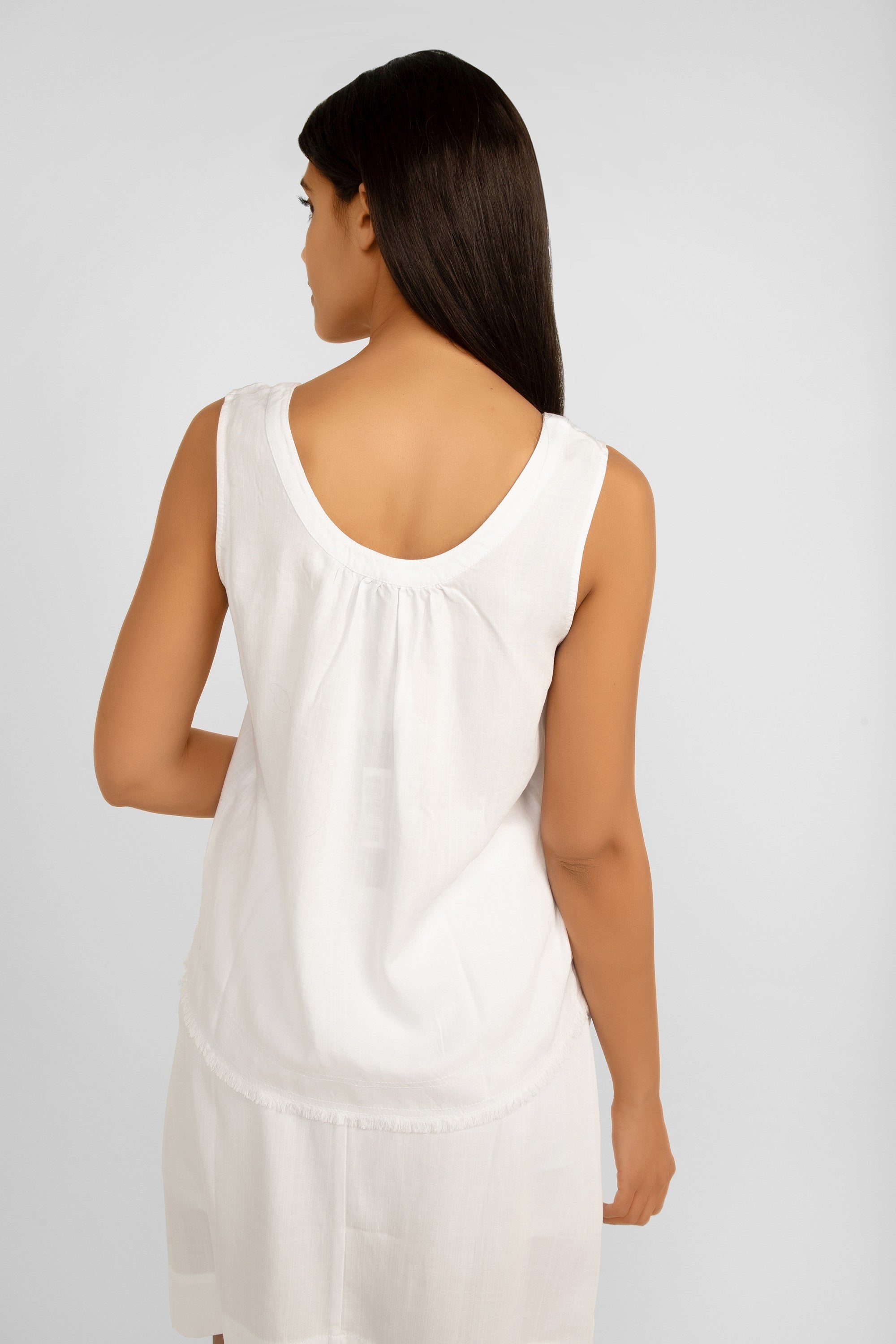 Back view of Renuar Clothing (R5015-E2142) Women's Sleeveless Tencel Tank Top with Button Front & Frayed Hem in White