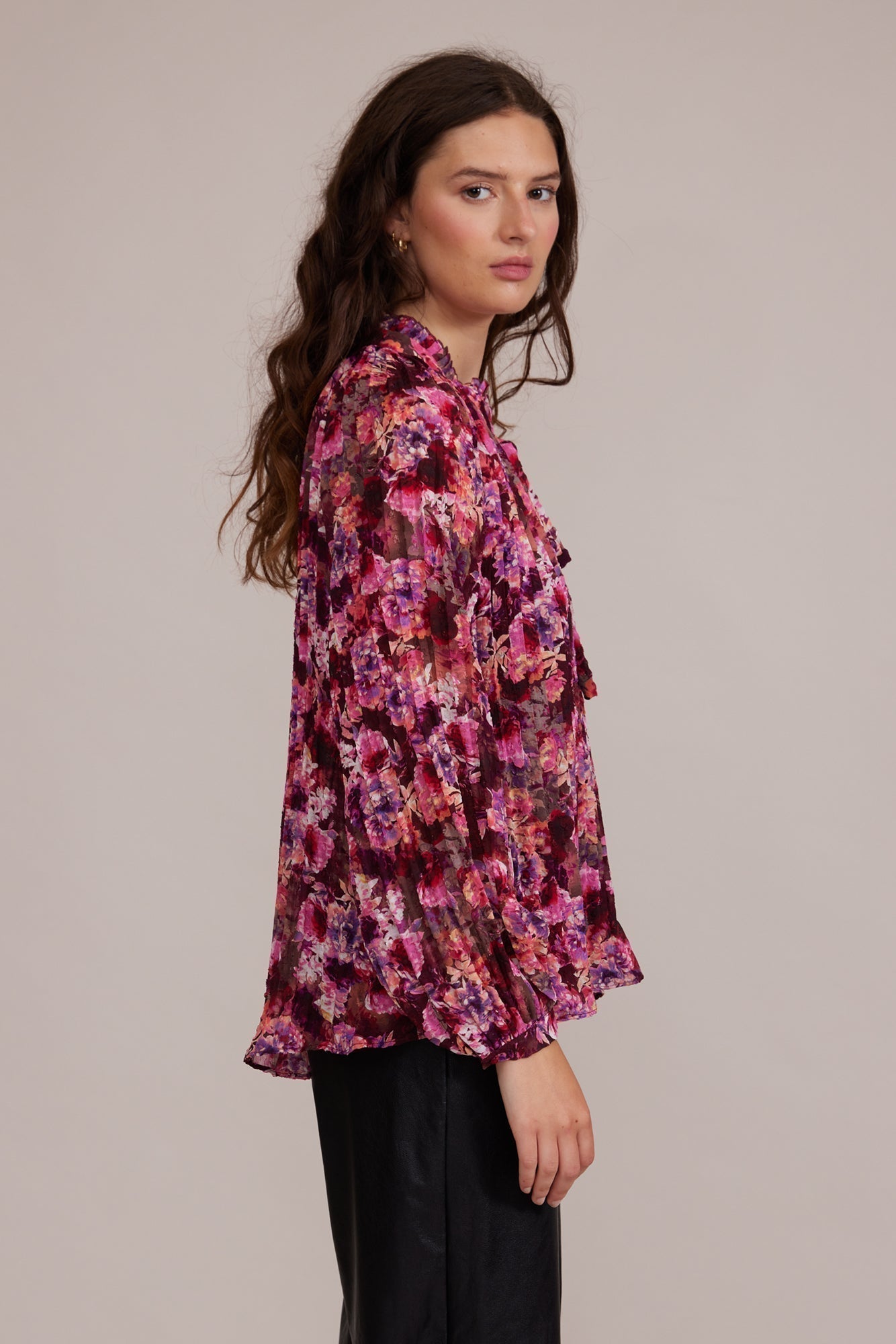 Side view of Lucy Paris (T2538-8) Women's Long Sleeve Pleated Chiffon Blouse with Split V-neck and Tie in Magenta Pink Floral Print