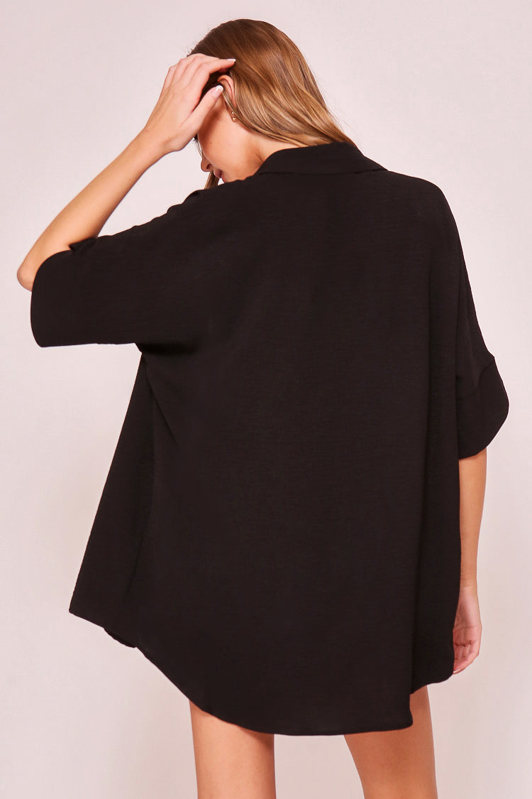 Back view of Timing (WN10311) Women's Short Dolman Sleeve Button Down Shirt with Shirt Collar in Black