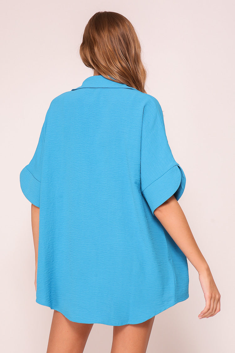Back view of Timing (WN10311) Women's Short Dolman Sleeve Button Down Shirt with Shirt Collar in Blue