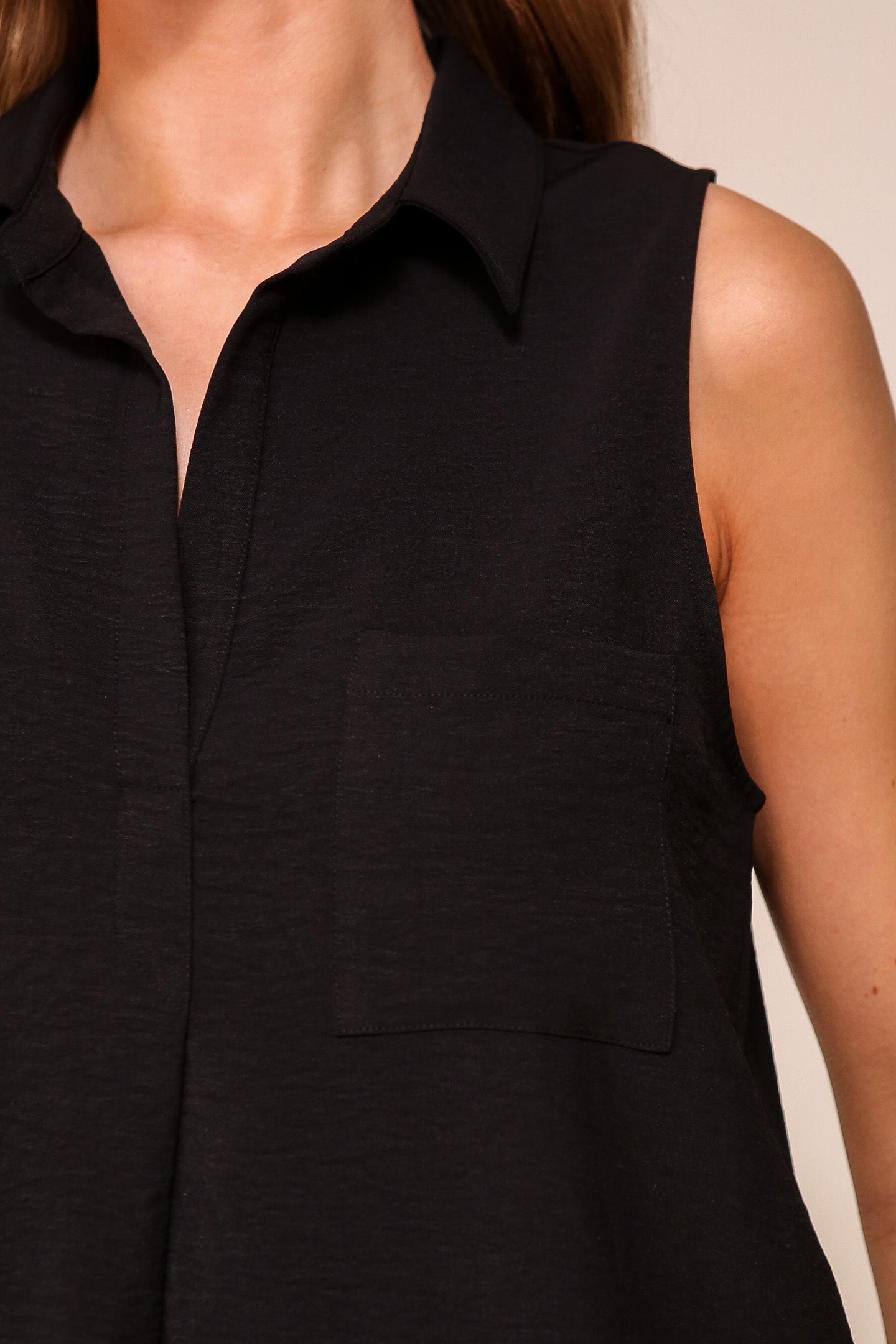 Front close up of Timing (WN9713) women's Sleeveless Collared V-Neck Top with Chest Pocket and Flared Silhouette in Black 