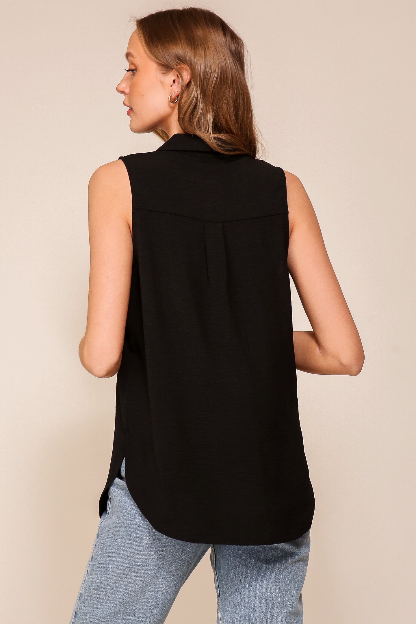 Back view of Timing (WN9713) women's Sleeveless Collared V-Neck Top with Chest Pocket and Flared Silhouette in Black 