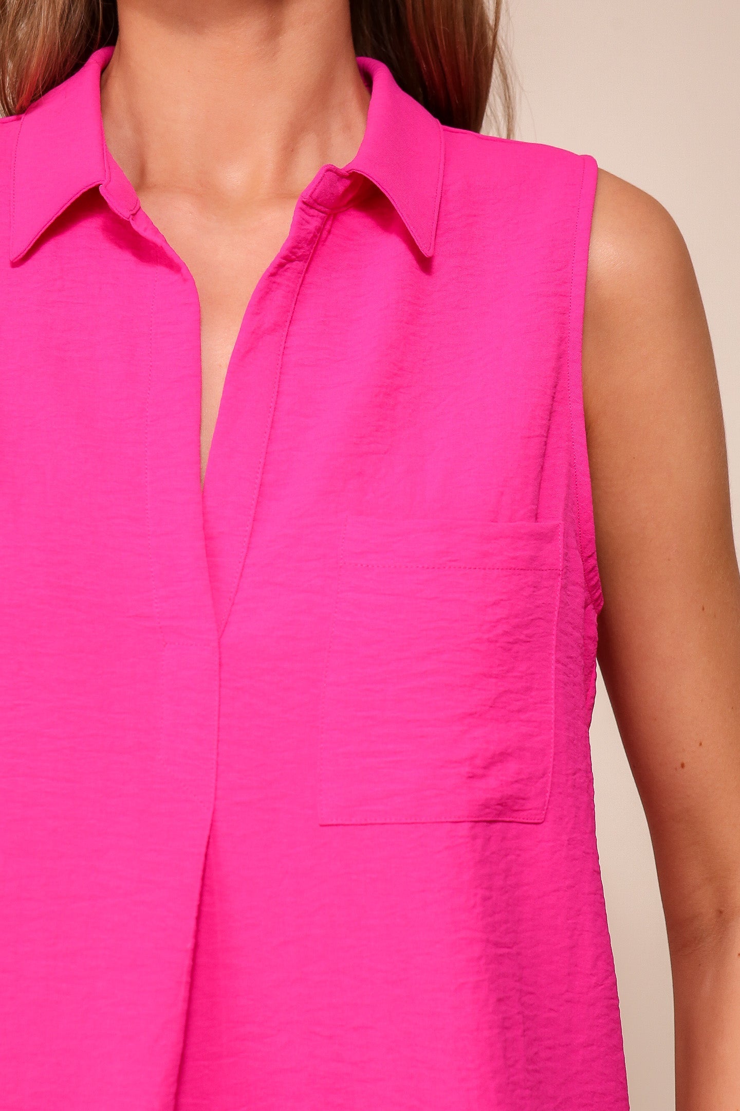 Front close up of Timing (WN9713) women's Sleeveless Collared V-Neck Top with Chest Pocket and Flared Silhouette in Pink